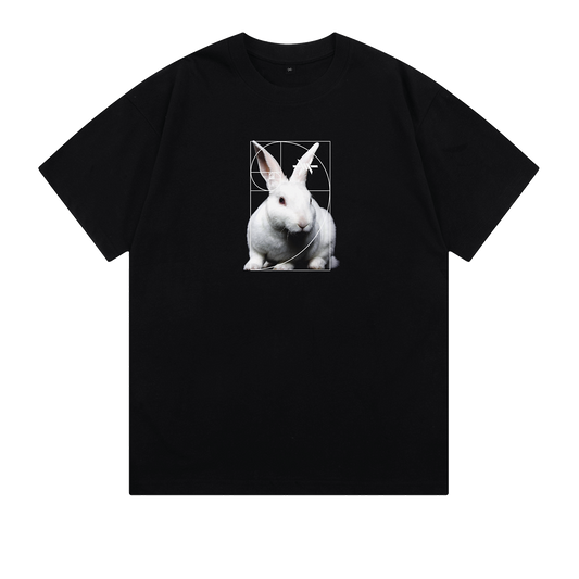 Ominous White Rabbit Heavyweight Tee - Black t-shirt with a white rabbit in the center, featuring a geometric pattern and a small 'Ominous' brand logo on its ear.