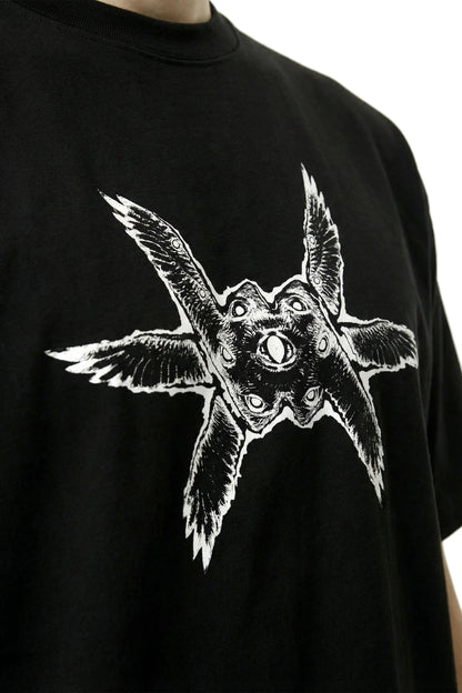 Close up of a black oversized heavyweight t-shirt with a white ominous angel seraph seraphim graphic design on a white background